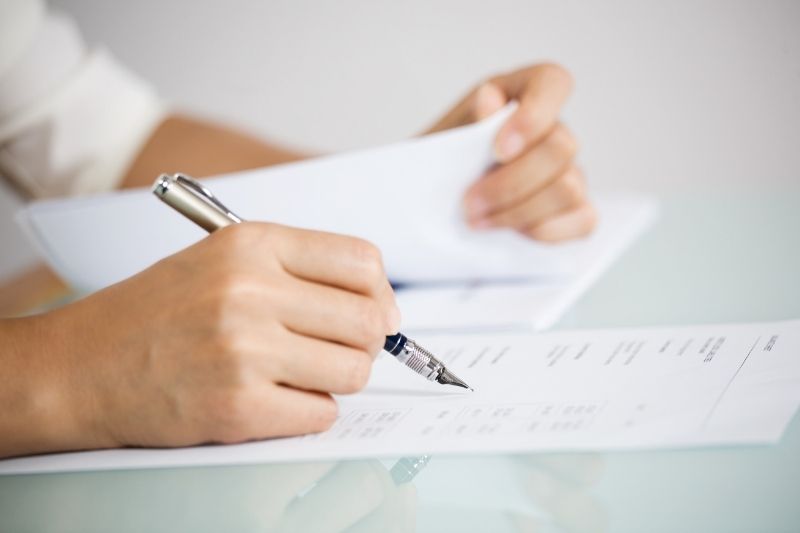 women writing on paper
